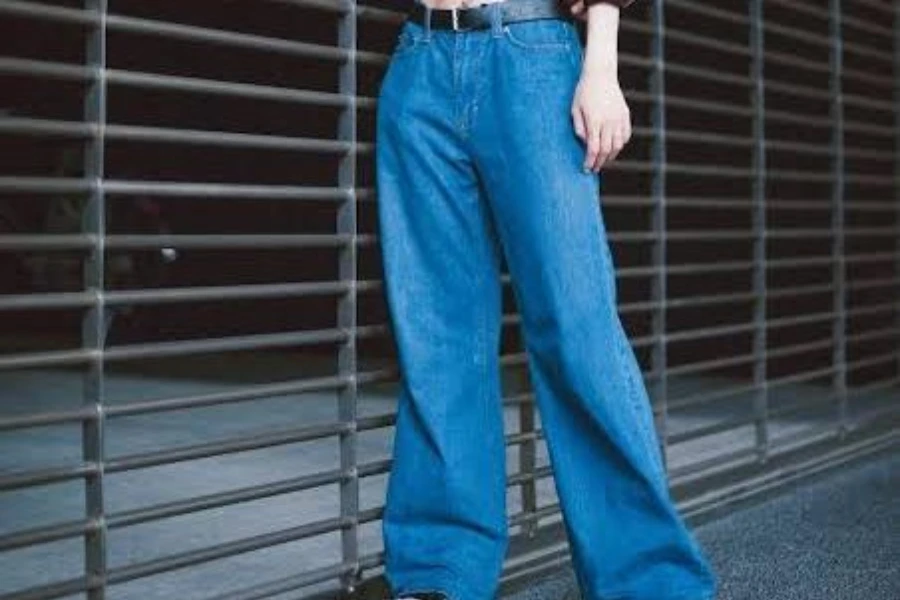 Woman wearing blue baggy jeans trousers