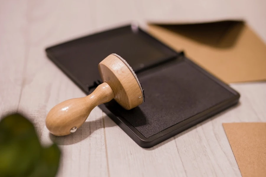 Wooden stamp on ink pad place on a desk