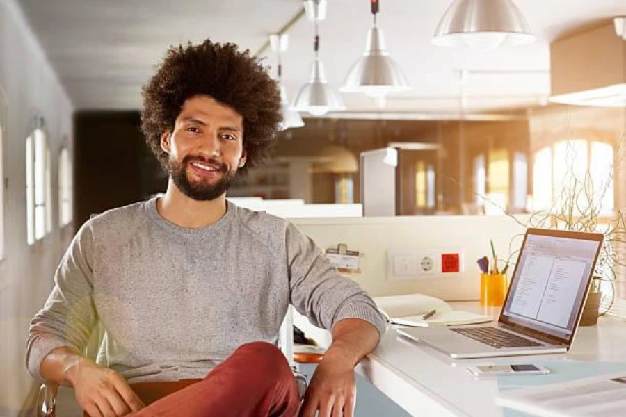 Young man at work wearing a sweatshirt