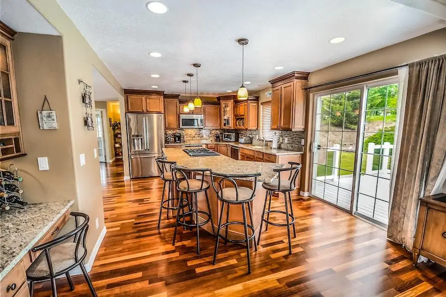 A kitchen with dotted ceiling lights