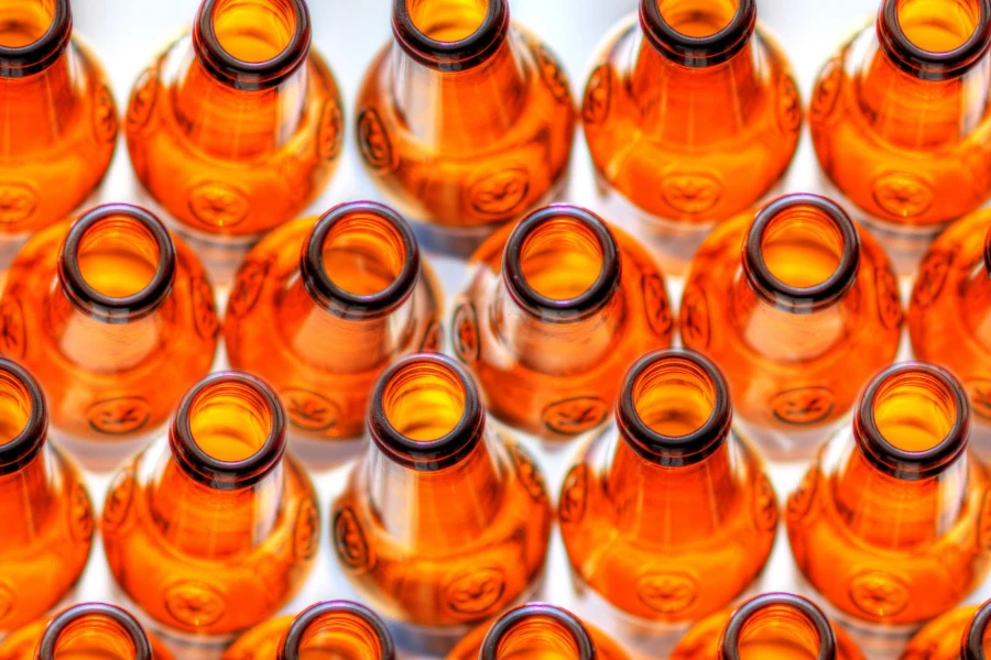 Amber-colored empty beer bottles