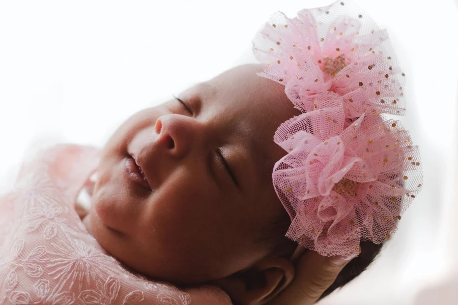 Baby wearing a headwrap with flowery details