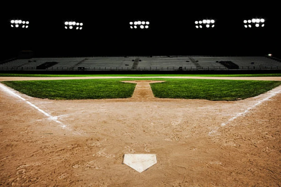 Baseball stadium at night with bright stadium lights turned on