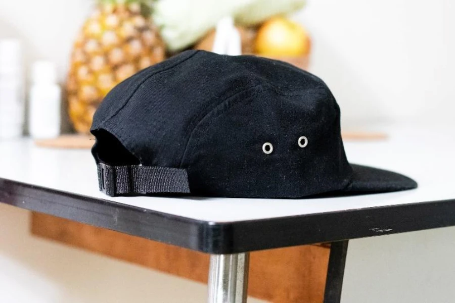 Black unstructured hat with nylon strap adjustable back