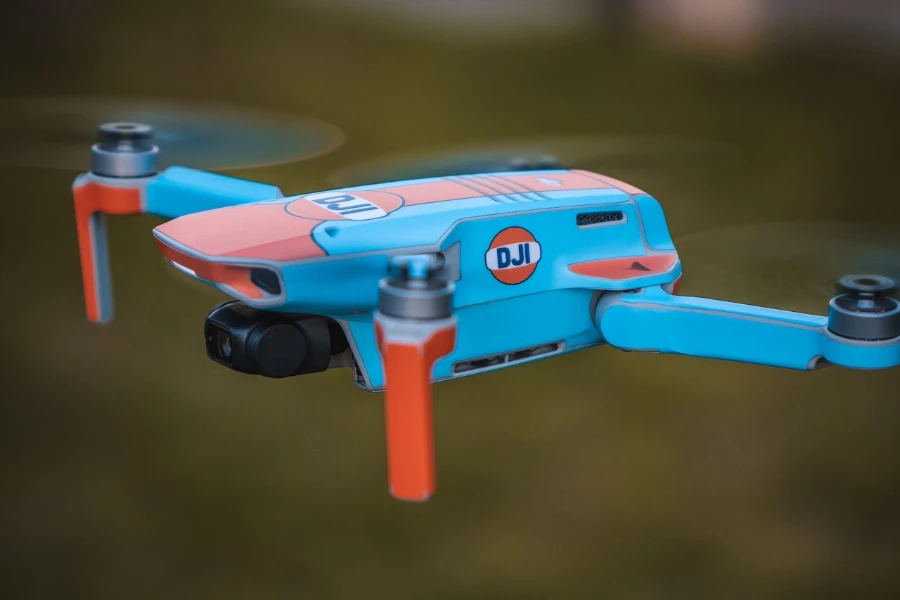 Blue and orange drone in flight