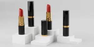 Four black and gold lipstick tubes