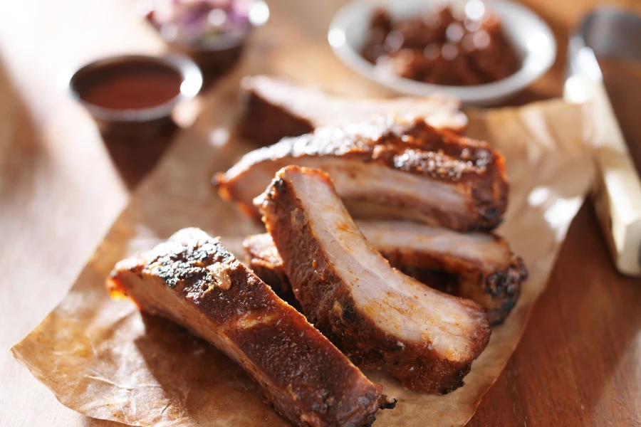 Grilled barbecued spare ribs placed on parchment paper