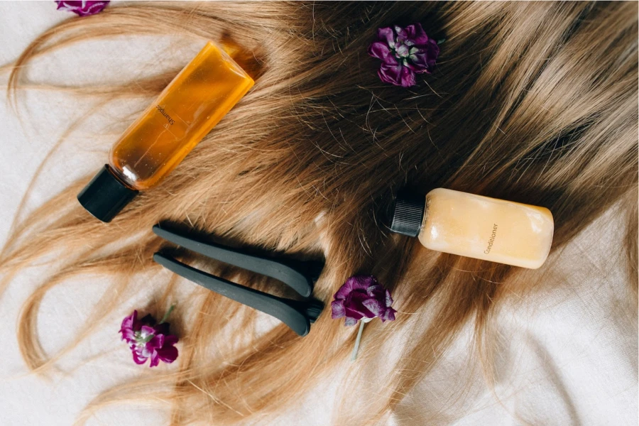 Hair products laying on a woman’s hair