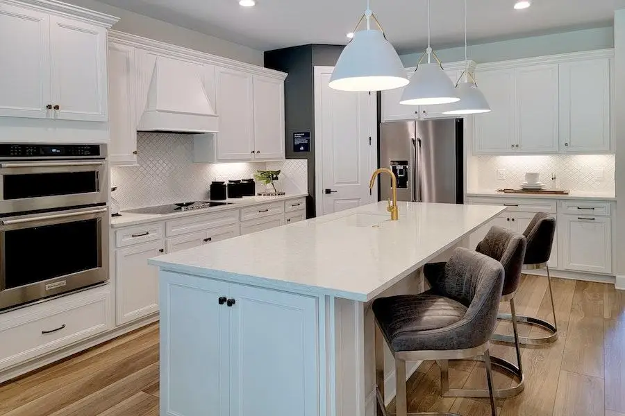 Kitchen with hanging and dotted ceiling lights