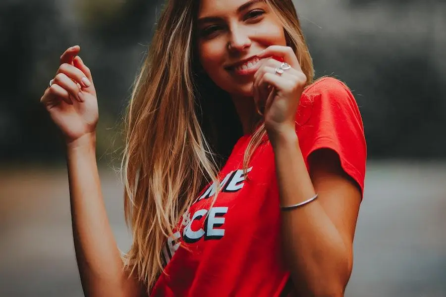 Lady posing in a red graphic tee