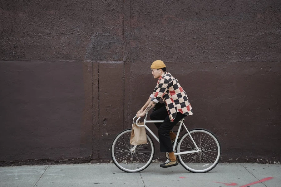 Man cycling in a multi-colored adventure shirt