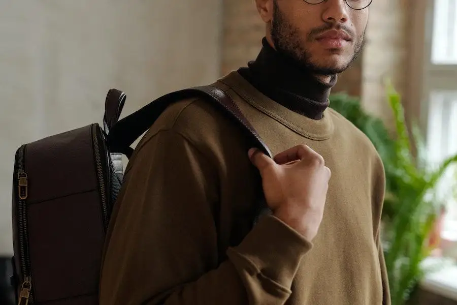 Man in a brown sweatshirt and turtleneck combo