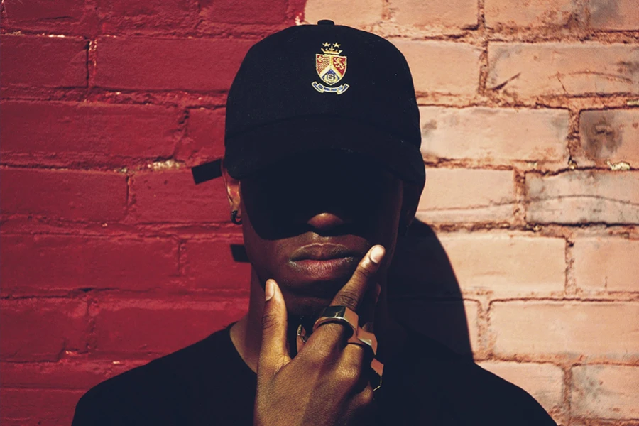 Man wearing a black snapback hat