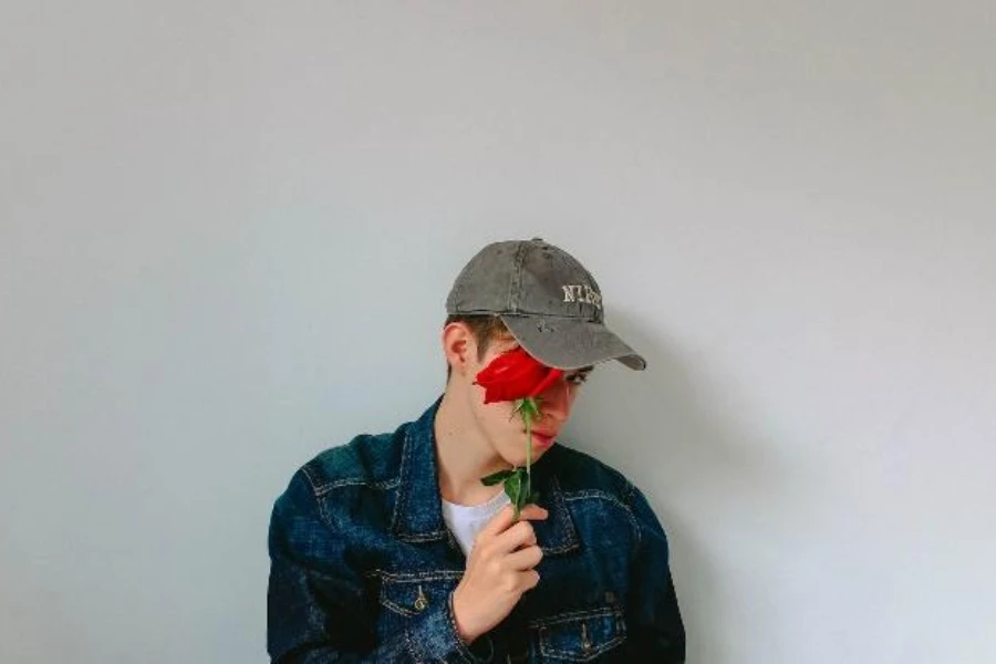 Man wearing gray faded baseball cap