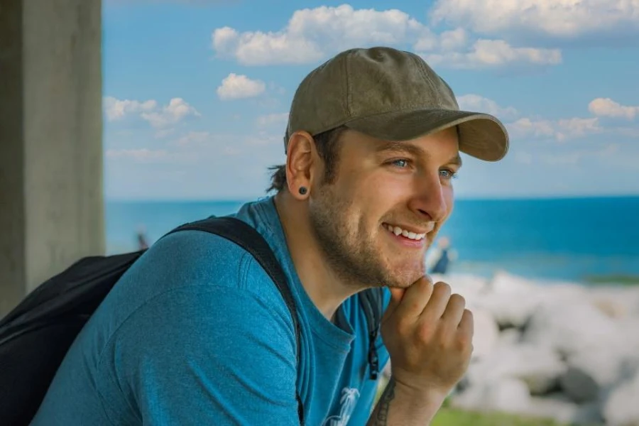 Man with khaki green dad cap