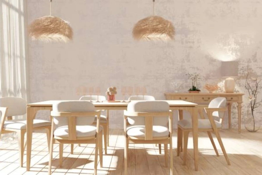 Neutral toned room with table and chairs below boho lighting