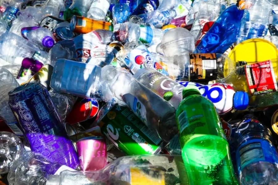 Pile of plastic bottles with aluminum cans