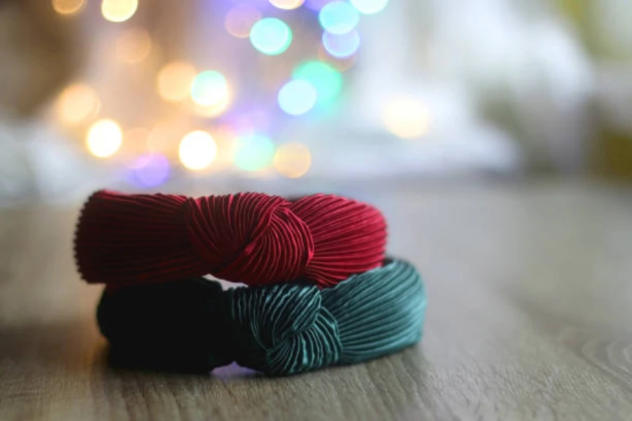 Red and green knotted headbands sitting on a table
