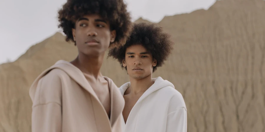 Two men with afros wearing hoodies