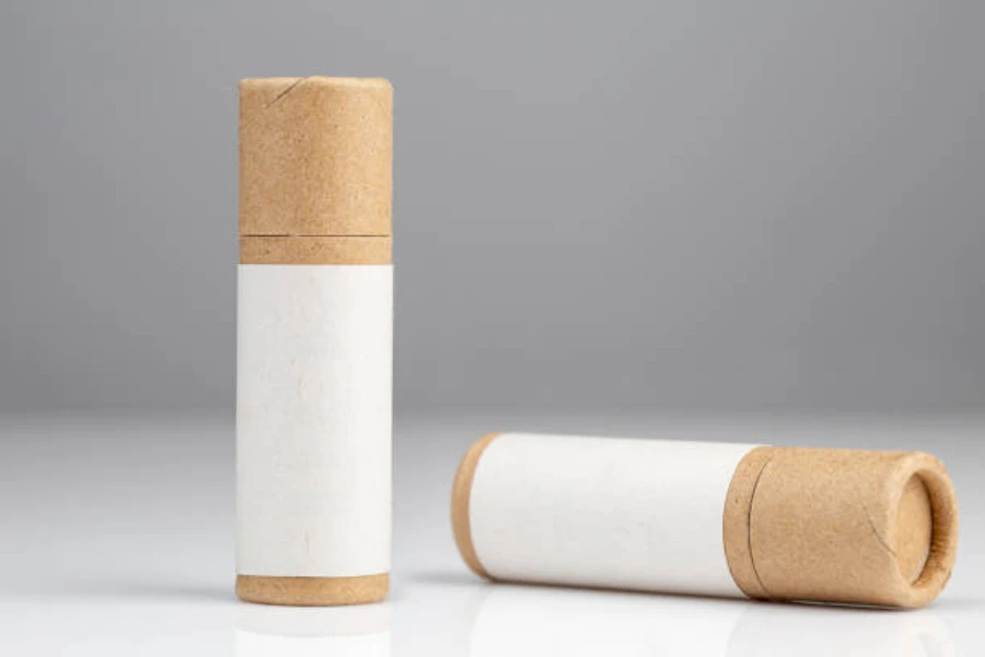Two paper tubes with lids to hold lipstick inside