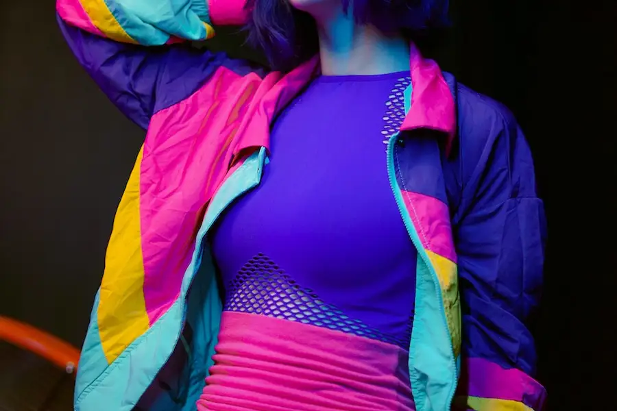Woman rocking a multi-colored jacket and galactic cobalt corset