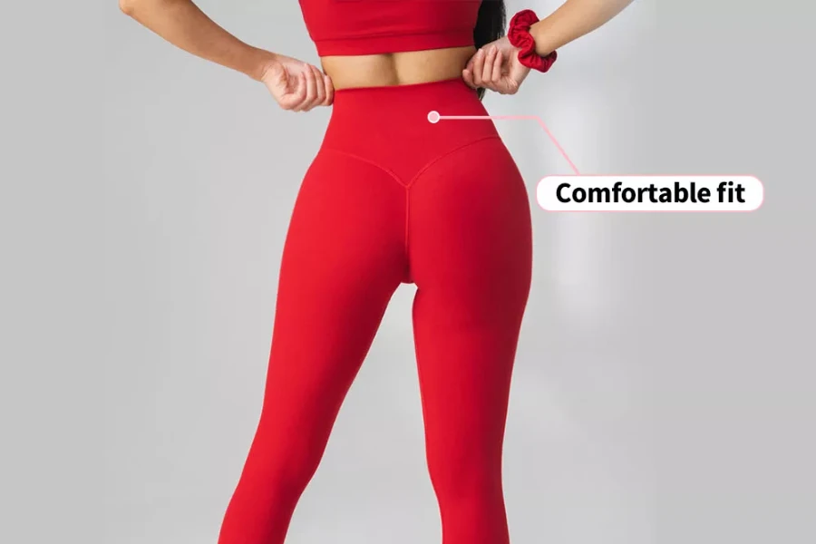 Woman showcasing red scrunch butt leggings