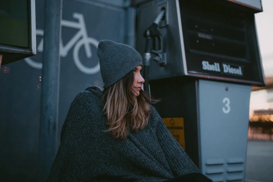 Woman wearing a black knit lined beanie hat