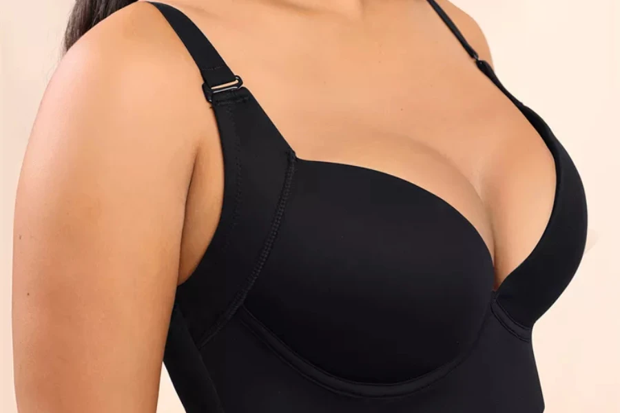 Woman wearing a black sculpting uplift bra