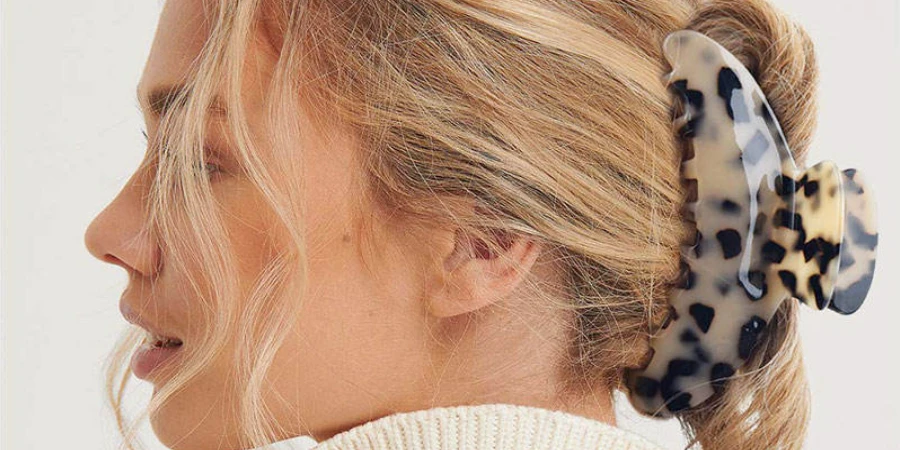 Woman wearing a jumbo acetate hair claw clip
