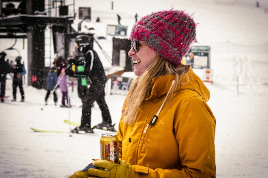 Woman wearing a multi-colored knit distressed beanie hat