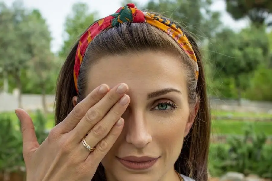 Woman wearing a red and yellow fabric headband