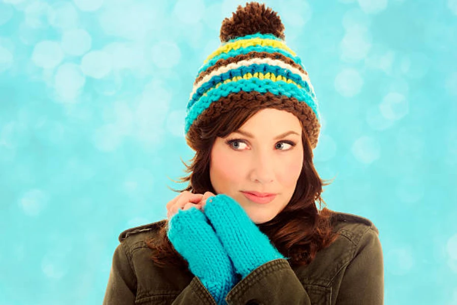 Woman wearing cable knit beanie with matching sweater