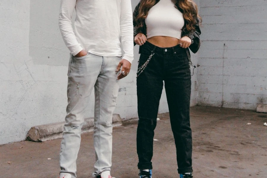Woman wearing cuffed slim-leg jeans posing with a man