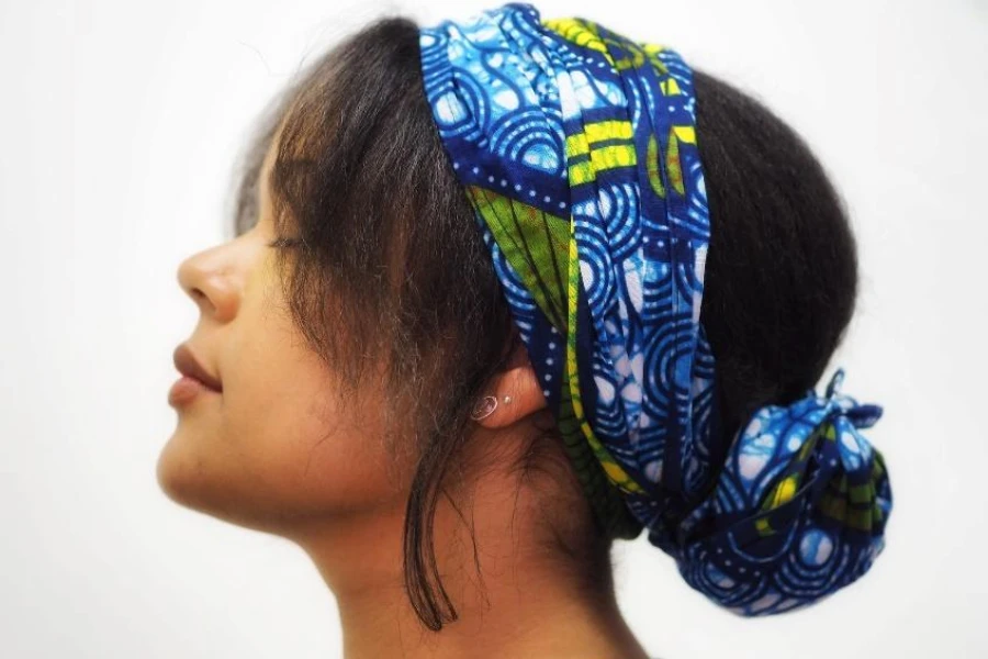 Woman wearing printed silk hair scarf