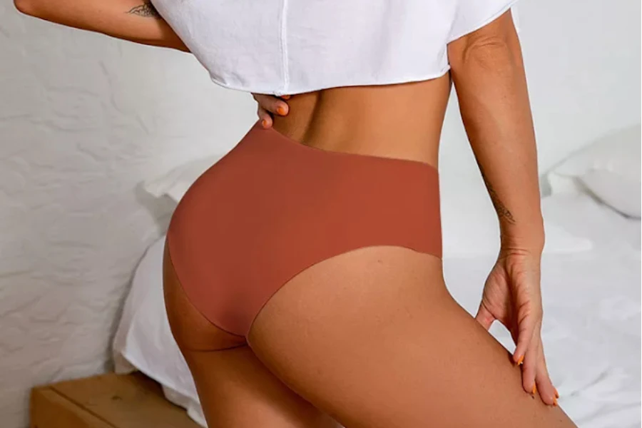 Woman wearing seamless laser-cutting panties
