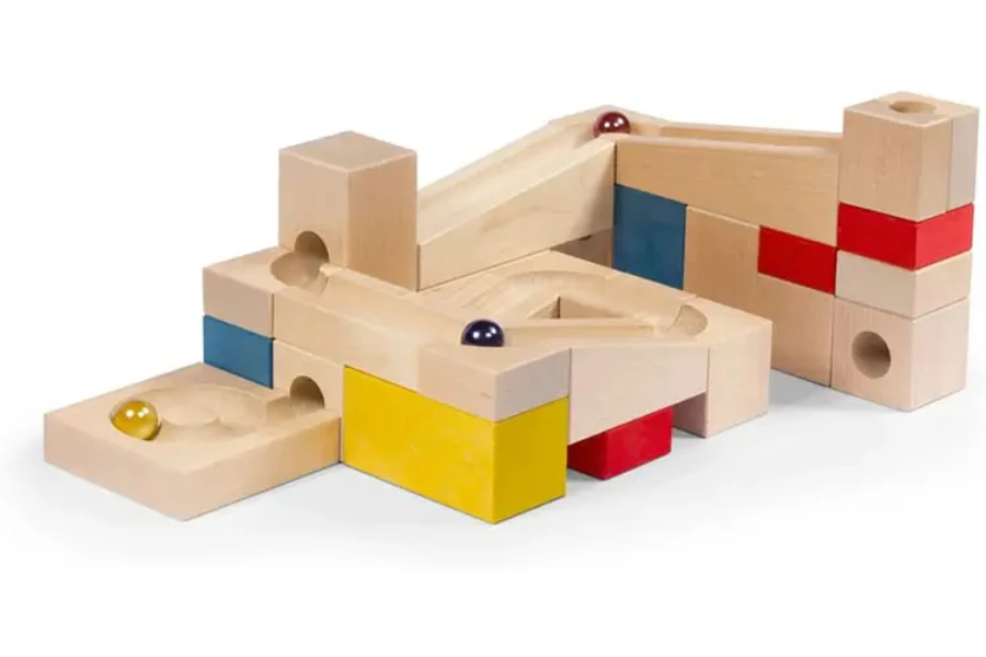 Wooden race track made with building blocks for marbles