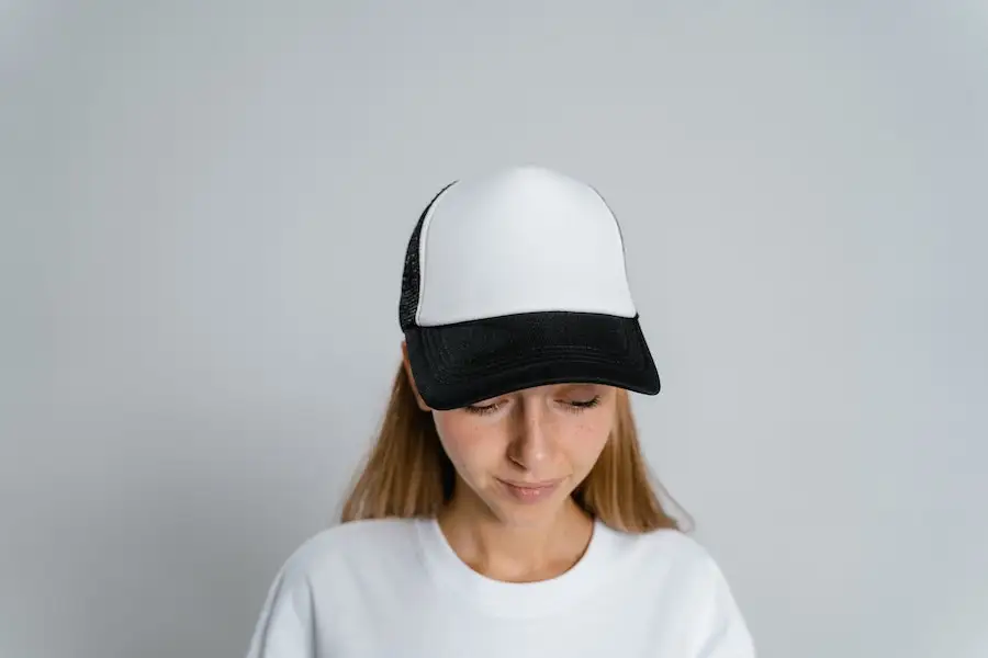 Young lady rocking a white and black snapback