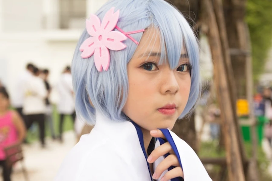 Young woman wearing custom hair clips over blue