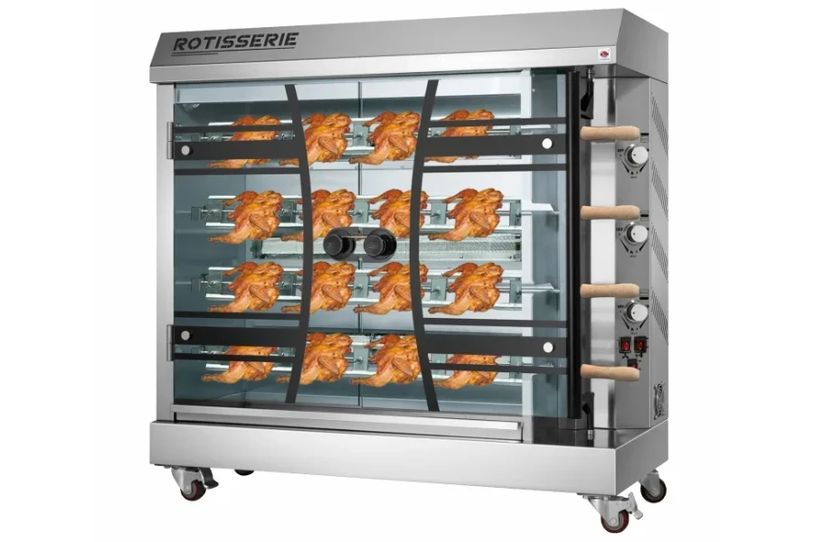 A commercial rotisserie oven grilling several chickens