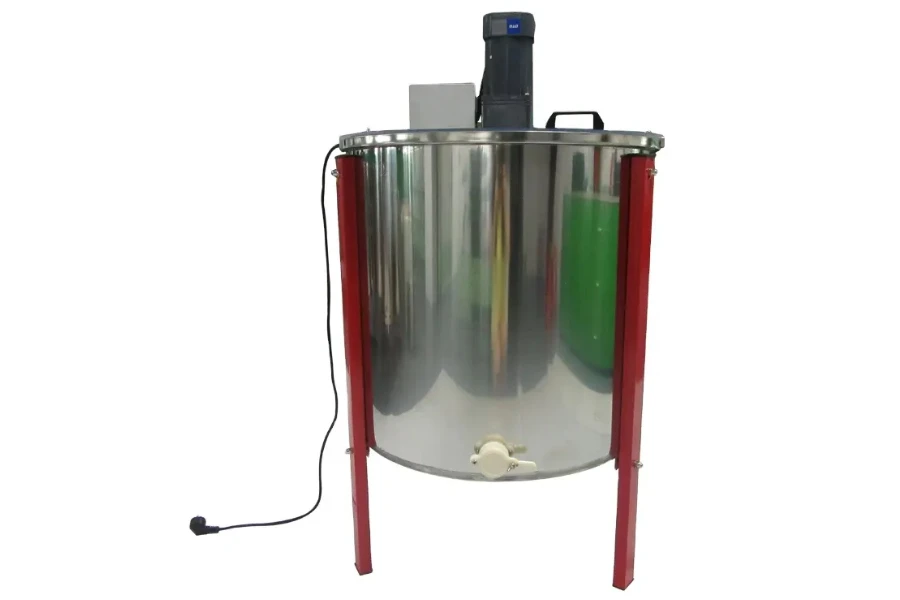 A manual honey making machine on a white background