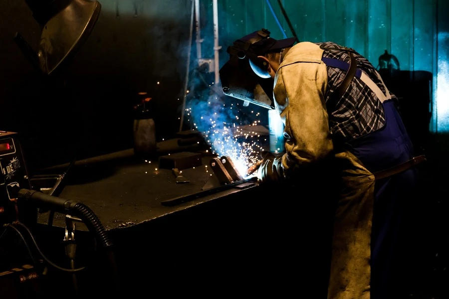 A welding operator welding in a factory