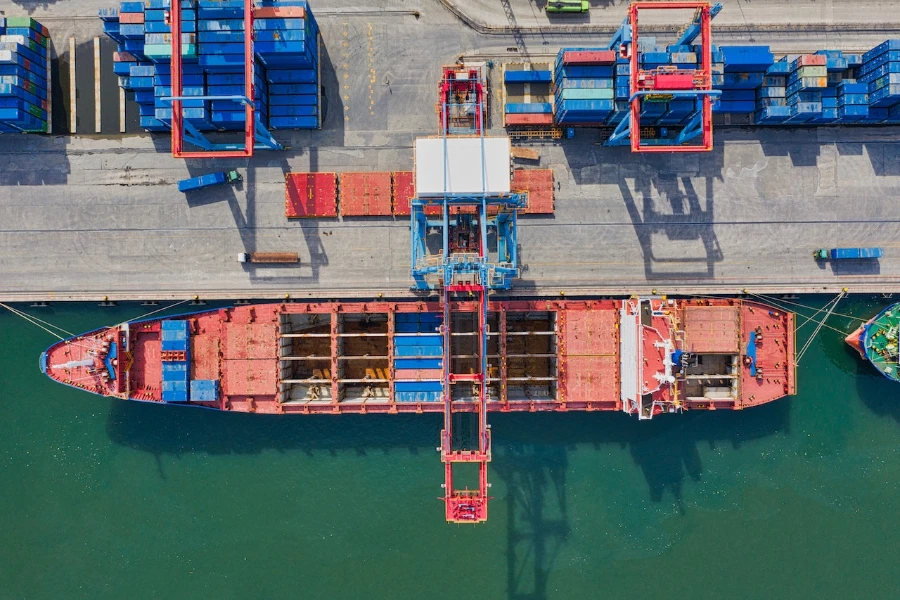 Aerial view of a cargo ship near intermodal containers