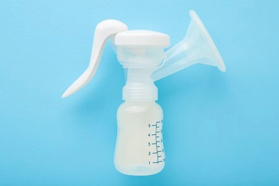 An electric adjustable portable breast pump on blue background