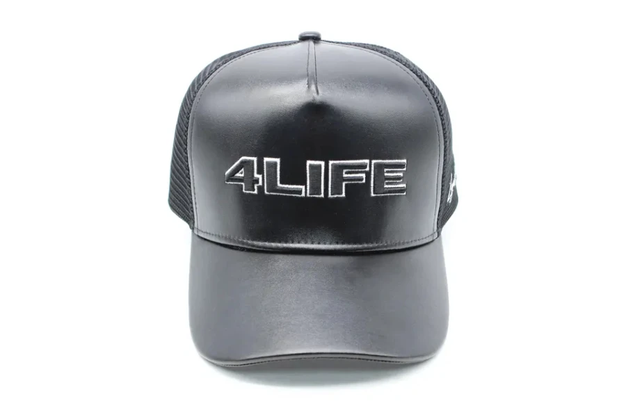 Black trucker hat with front made of faux leather