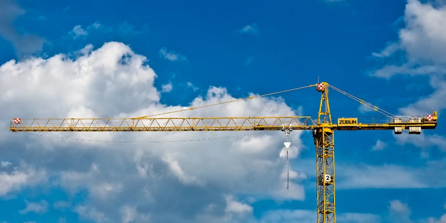 blue sky clouds construction crane