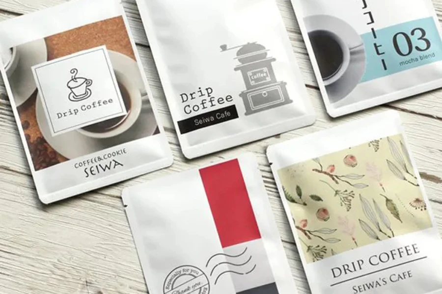 Coffee samples packaged in foil sachets sitting on table