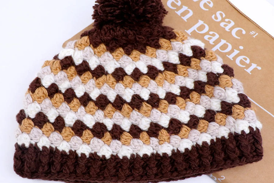 Display of a multi-color earth tone crochet beanie