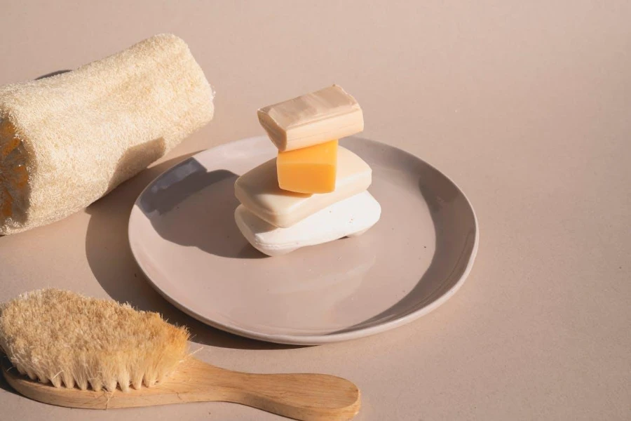 Four soaps stacked on a dish