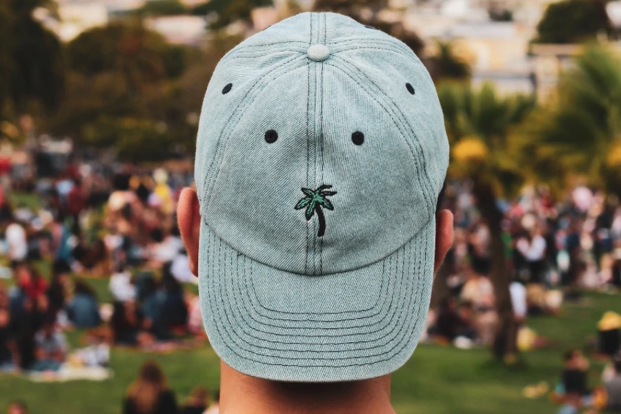 Light wash denim cap with embroidered palm tree logo