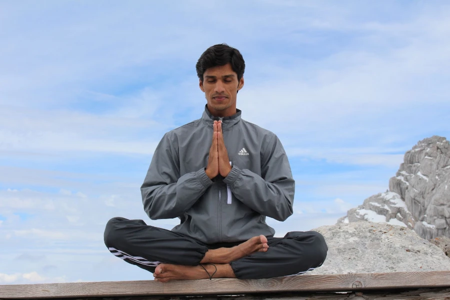 Man in yoga pose outdoors